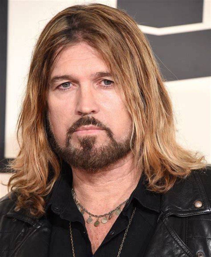 A Picture Of Billy Ray Cyrus Being Interviewed