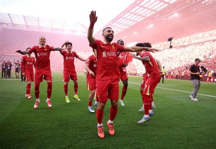 Liverpool players celebrate the opening goal scored by Harvey Elliot of Liverpool FC